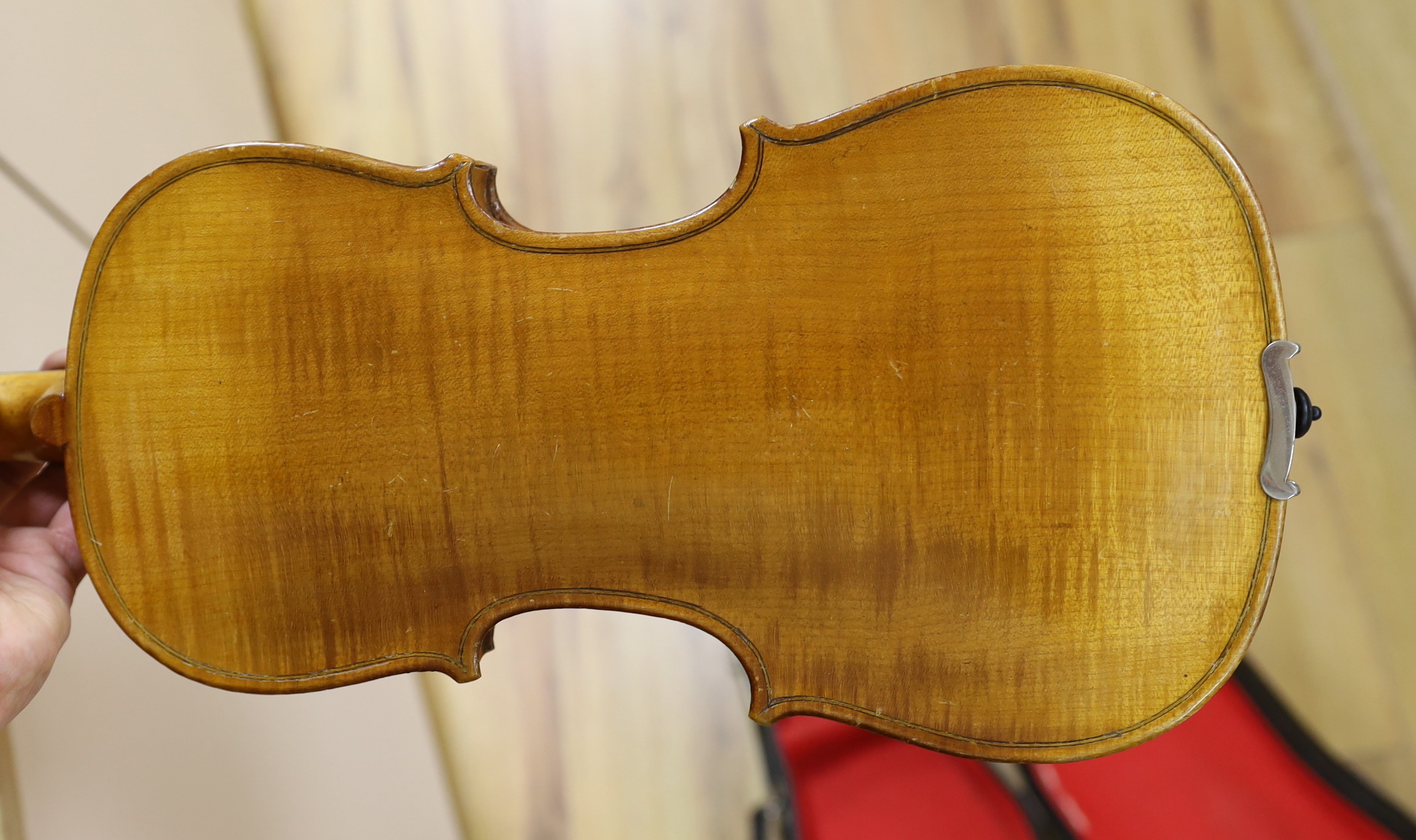 A cased student's violin, length of back 33 cm